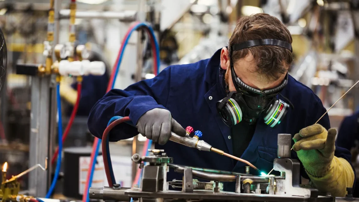 Man Pipe Welding wearing safety PPE