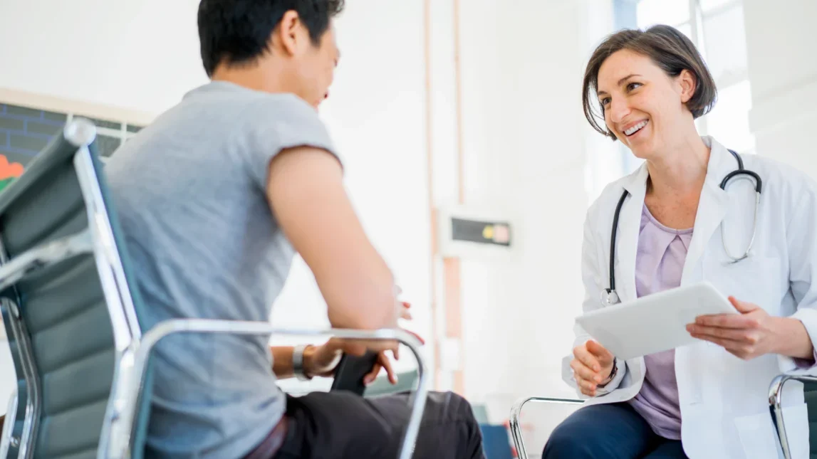 A doctor and patient sitting and talking